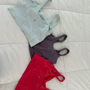 lululemon Tops in Light Blue, purple& pink (size 10 & 8) no boobie pads